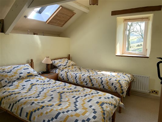 Twin bedroom with view up the valley